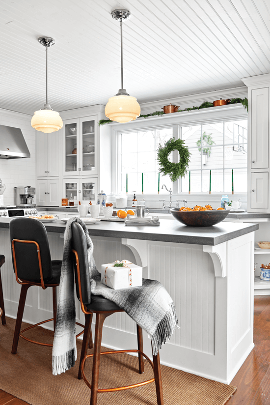 The large kitchen island gives extra counter space, and glass doors lighten the mood and add an airy touch.