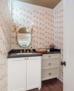 small powder room with hummingbird wallpaper