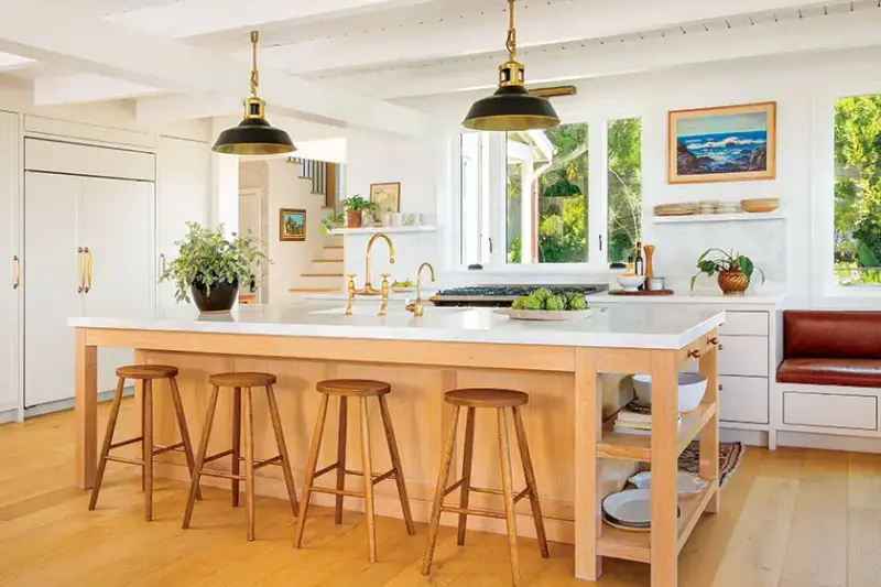 kitchen with large island with built-in storage in 1940s beach cottage