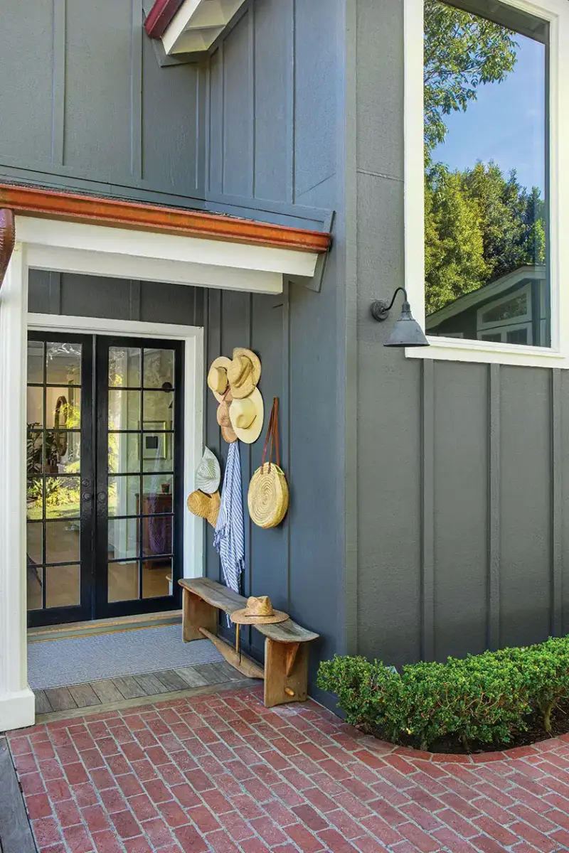 entryway with beach hat hooks create an entryway vignette to this 1940s beach cottage