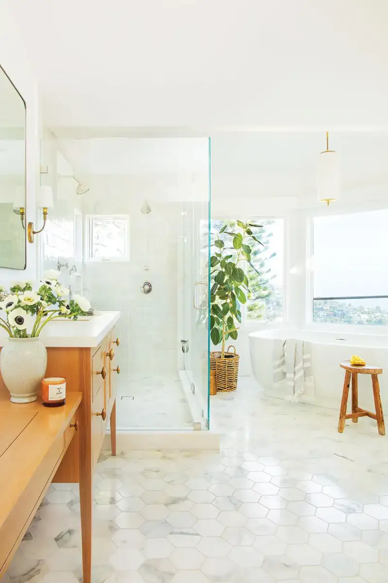 soaking tub with a view in master bath of 1940s beach cottage