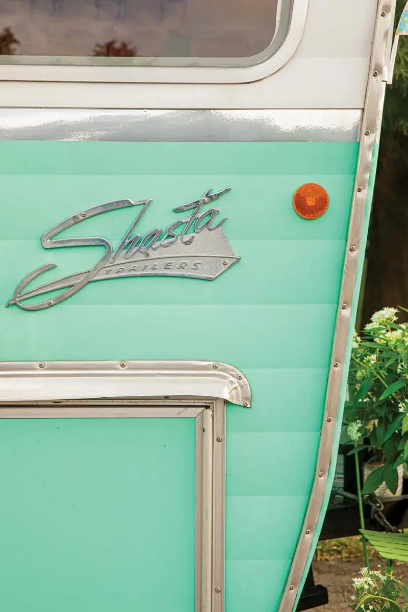 bright turquoise exterior of Shasta trailer