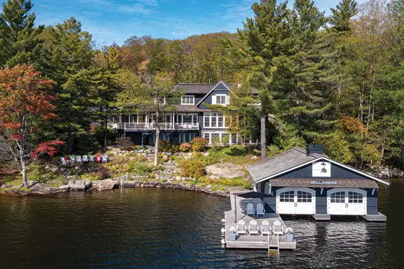 lakeside cottage farmhouse named Bellamere in Lake Muskoka exterior including dock