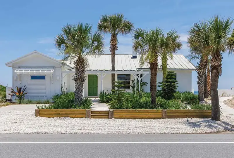 front exterior of renovated Florida beach bungalow previously hurricane damaged