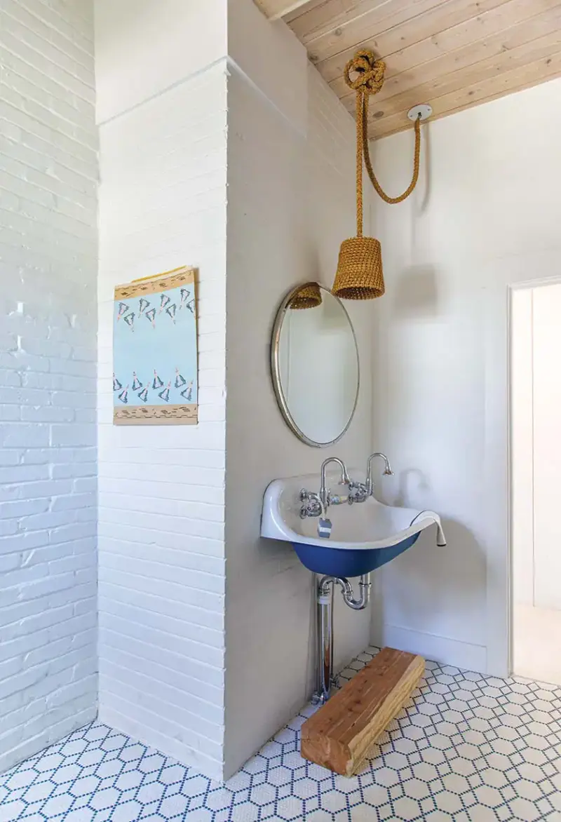 hexagonal tile on bathroom floor of coastal home