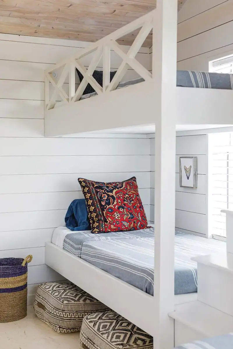 bunk beds and shiplap walls in guest room of Florida beach bungalow