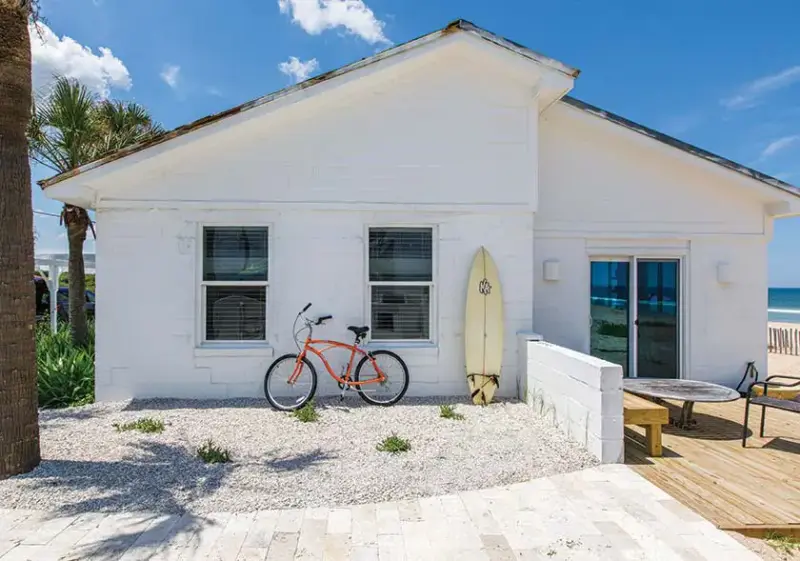 rear exterior of white Florida beach bungalow