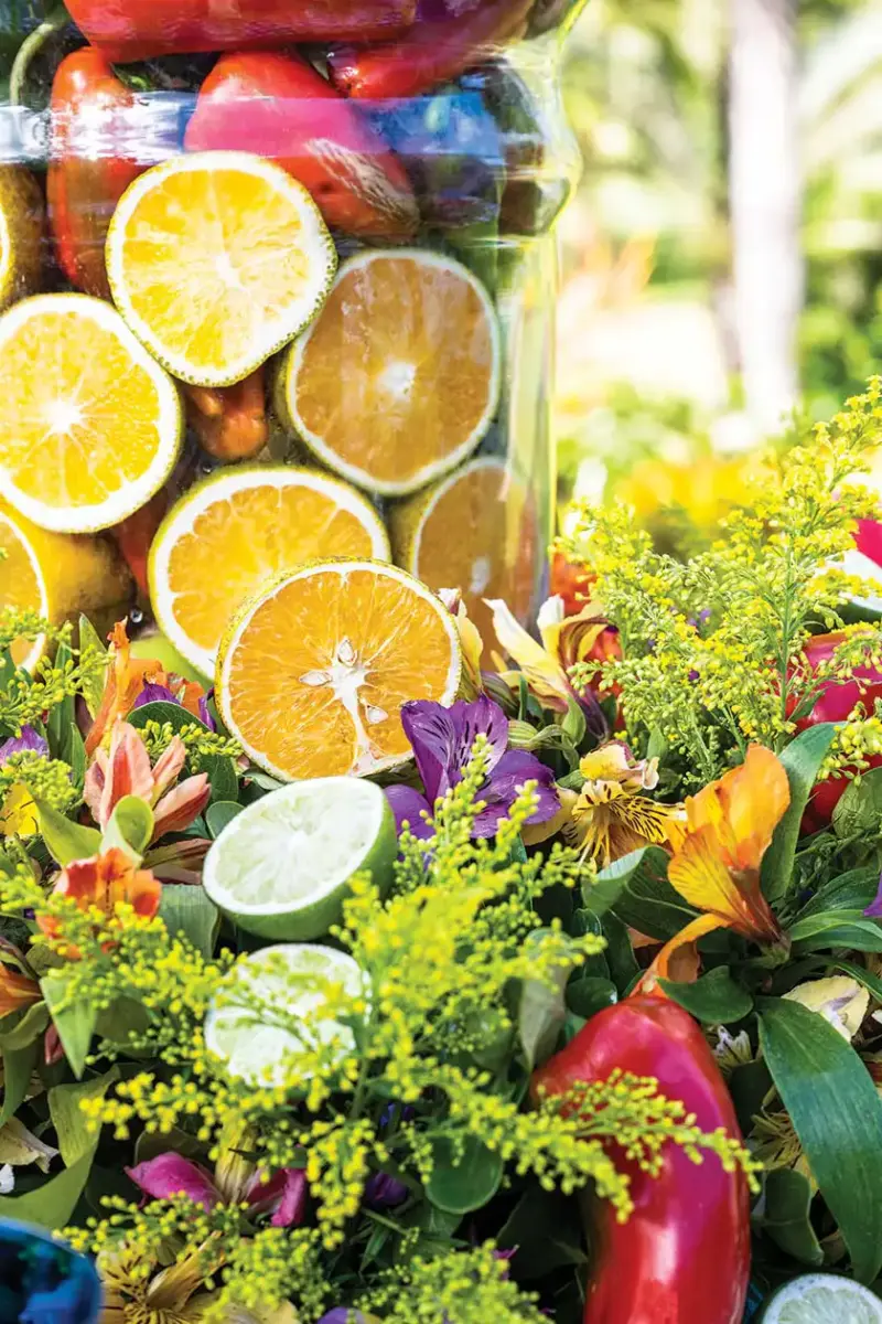 close up of flowers, citrus and peppers in centerpiece of Italian inspired tablescape