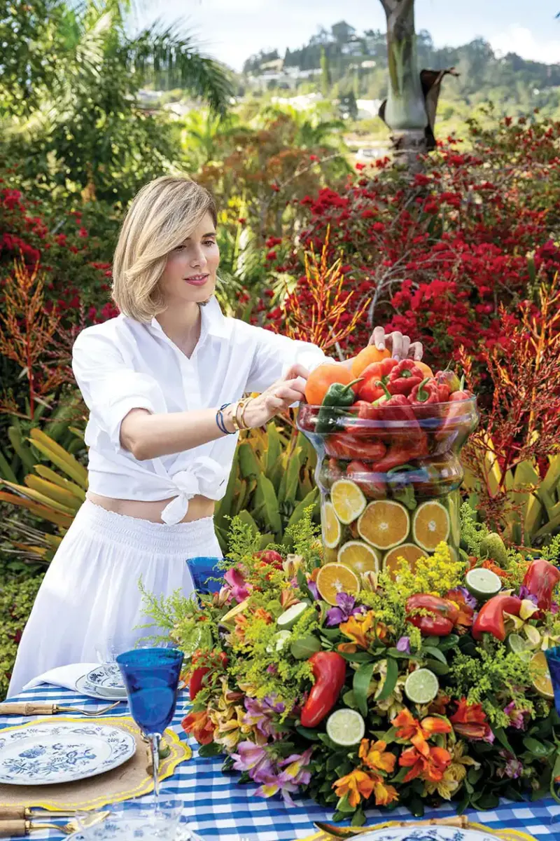 Andreina Chirinos Paoli styling the centerpiece of her tablescape