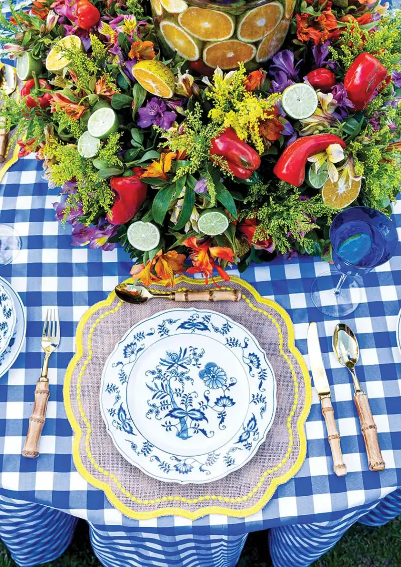 aerial view showing Italian inspired tablescape with blue and white plates and tablecloth