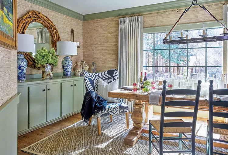 dining room with wood mirror rustic dining table and green storage cabinets