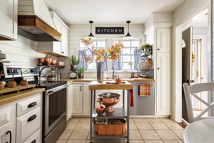 cozy cottage fall kitchen with copper bowls, fall branches and orange plaid dishtowels