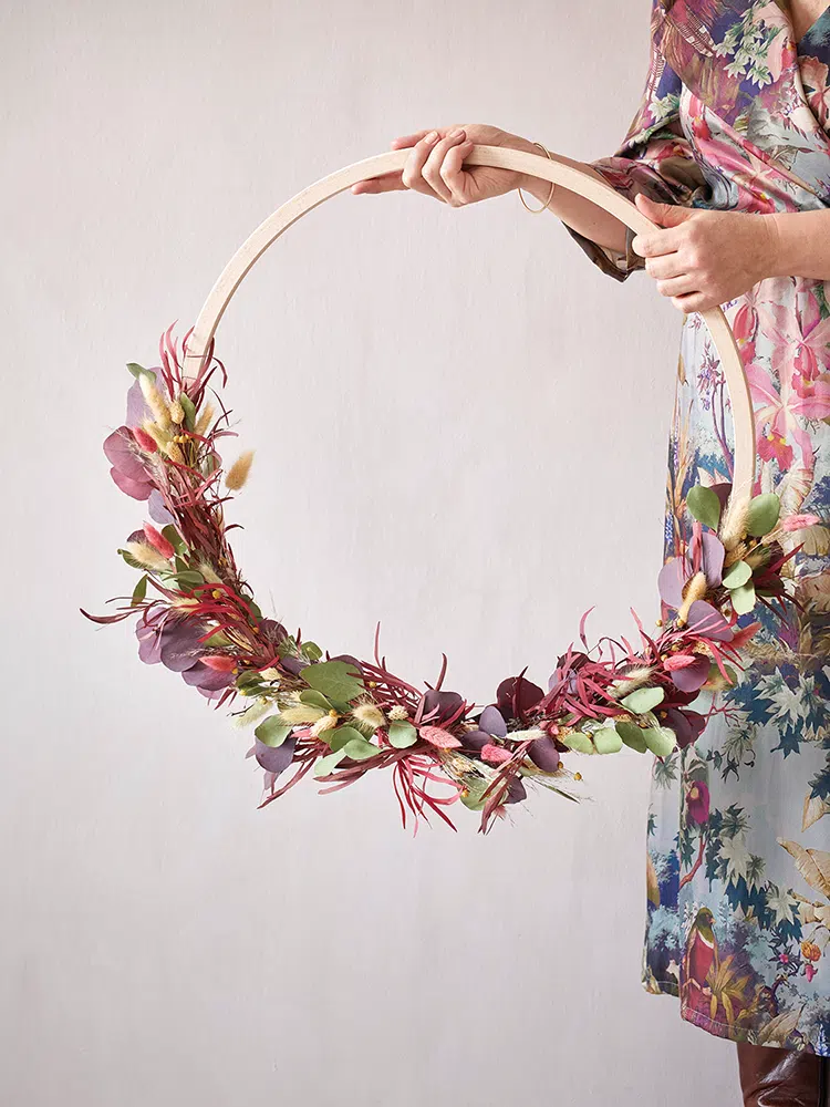 wooden decorative wreath with dried flowers