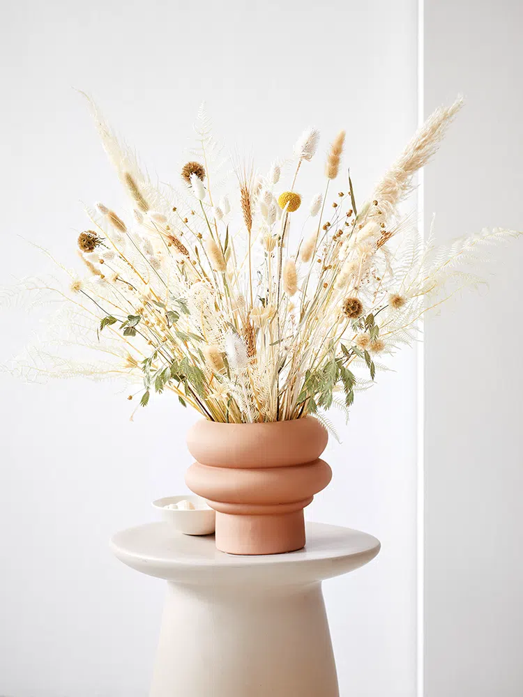 bouquet of dried plants with a variety of grasses