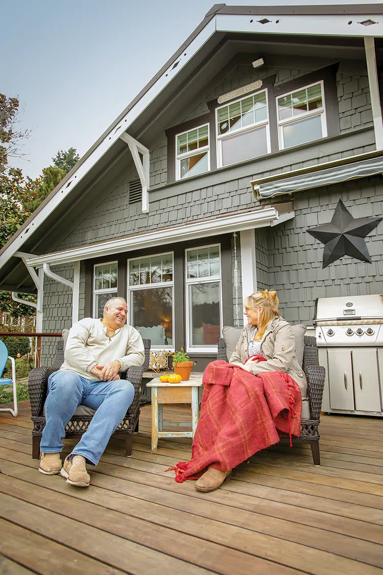 homeowners enjoy their deck space in their home on Puget Sound