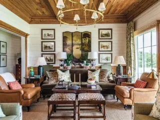 natural wood ceiling and window frames in sitting room of unique Georgia home inspired by historic hunting houses