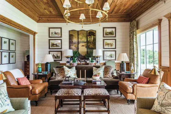 natural wood ceiling and window frames in sitting room of unique Georgia home inspired by historic hunting houses