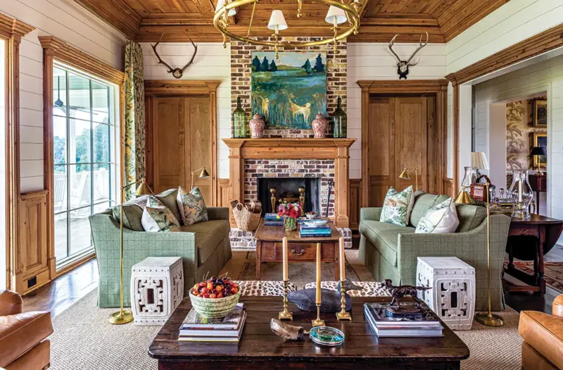 brick fireplace in collected Georgia home inspired by historic hunting homes