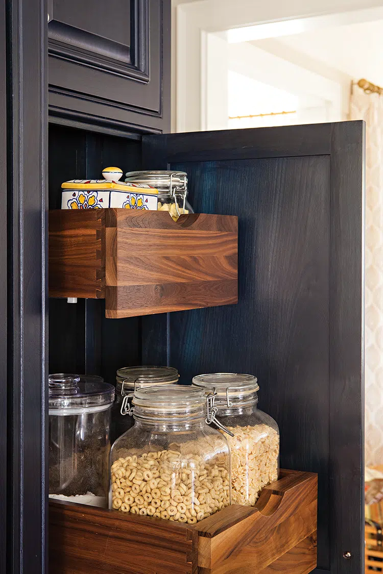 pantry storage with pullout drawers in black cabinet of renovated La Jolla kitchen