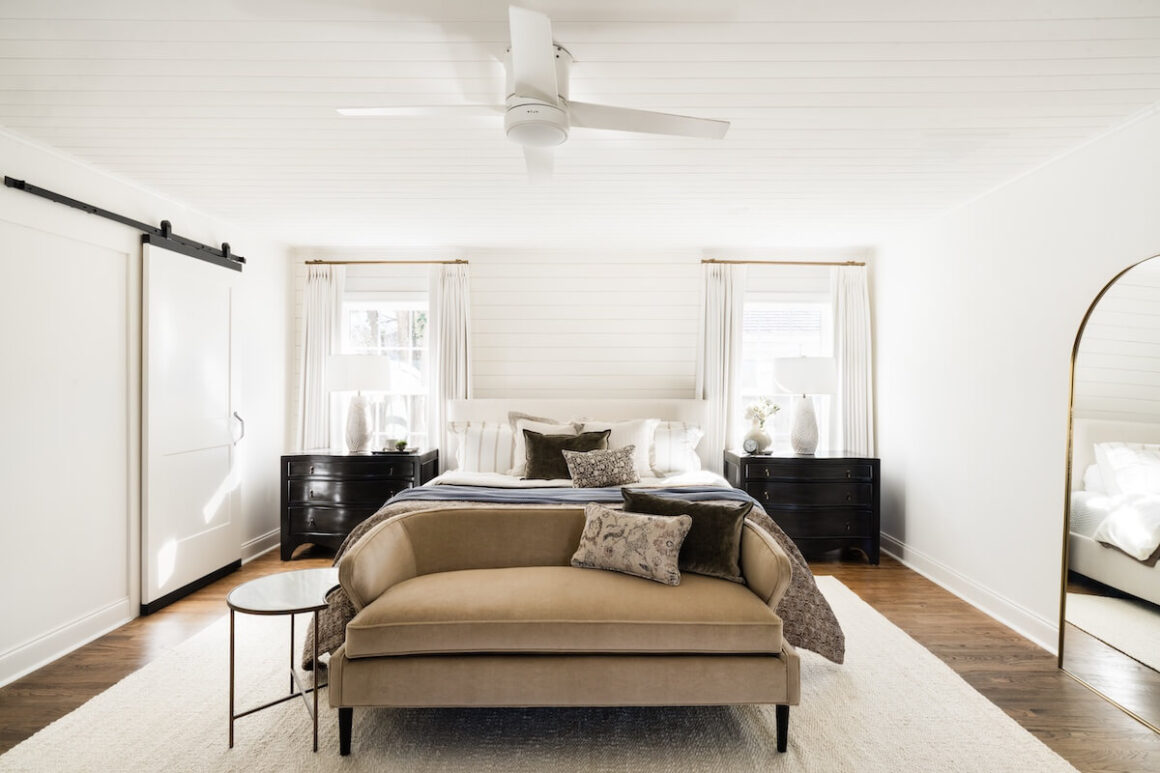 neutral bedroom with barn style door shiplap walls in Georgetown bungalow