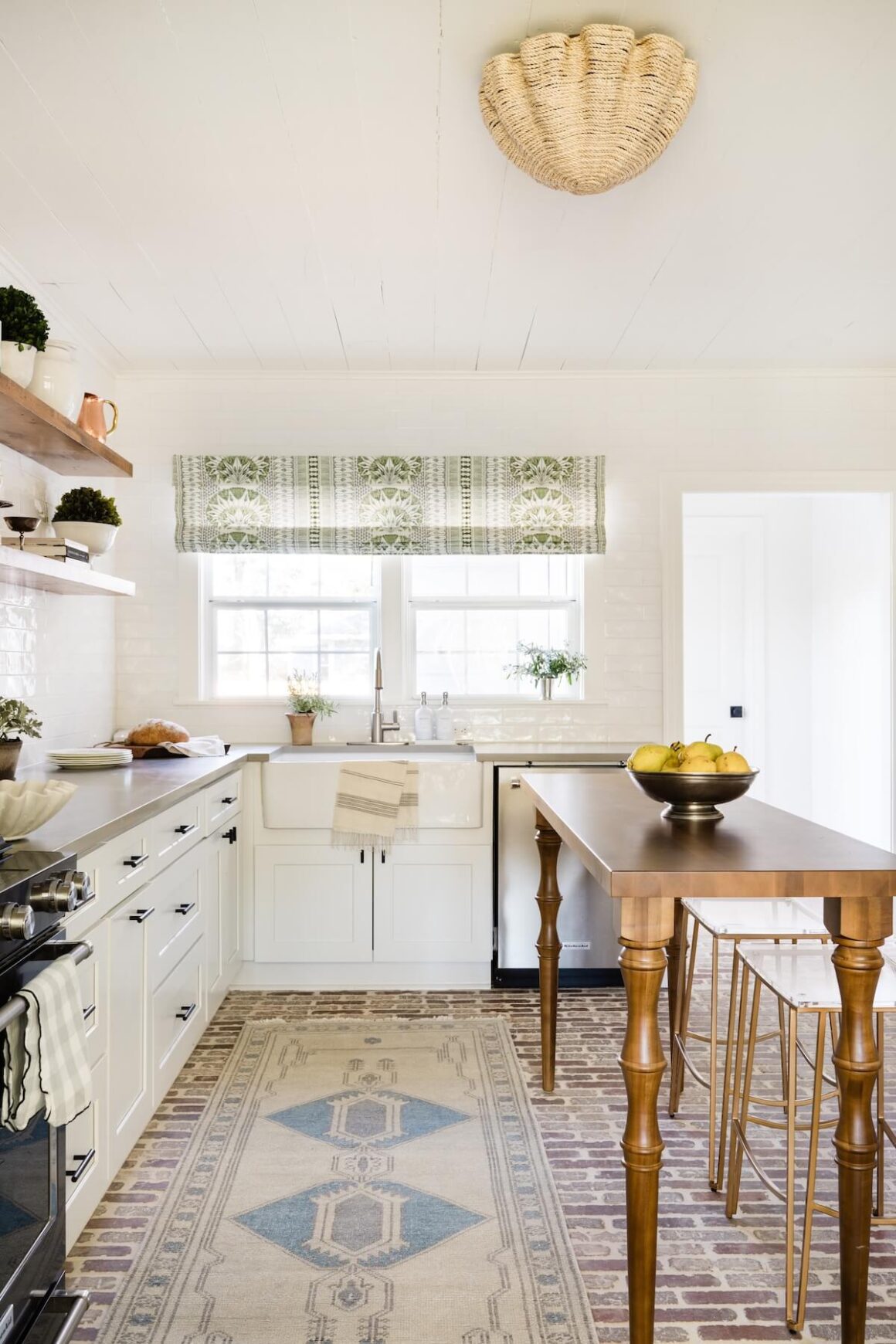 kitchen with brick floor, exposed shelves and DIY wooden kitchen island