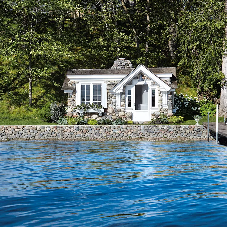 stone exterior of boathouse cottage along shore of Lake Minnetonka