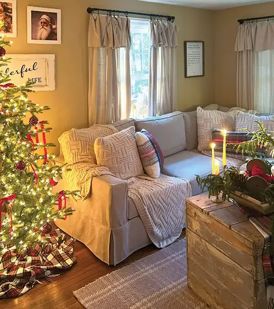 cozy little Christmas home living room with taper candles and Christmas tree with red bows