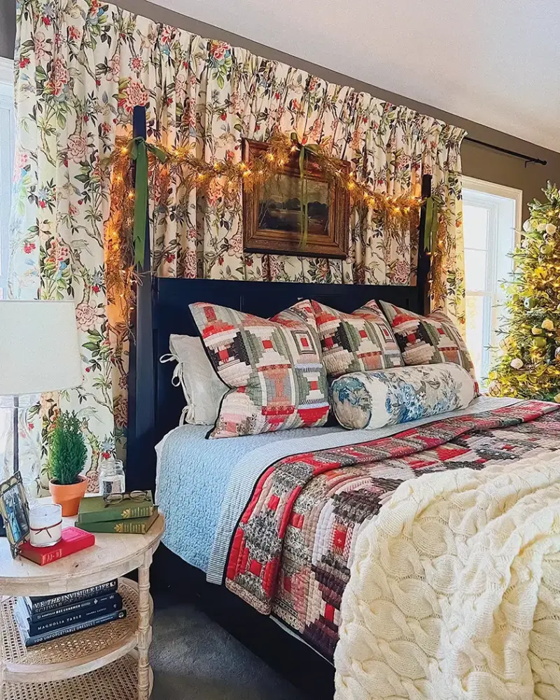 master bedroom with red and green curtains and quilted bedding