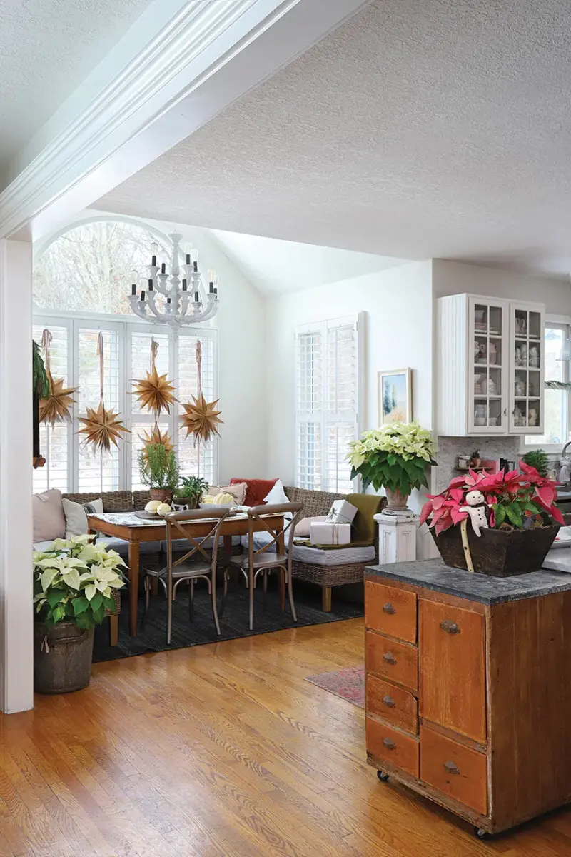 view of kitchen and breakfast nook in home with curated holiday collections