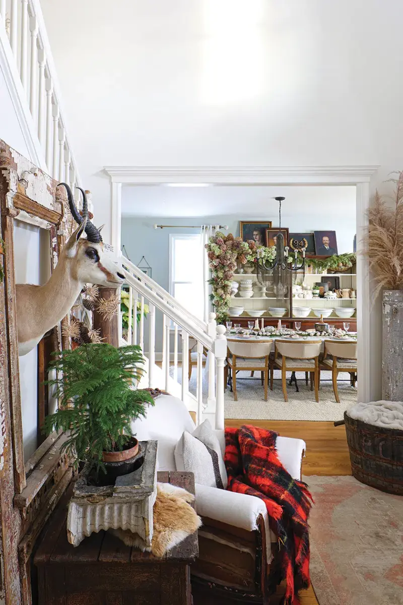 Michigan home decorated for the holidays with greenery and large bouquet of dried hydrangeas