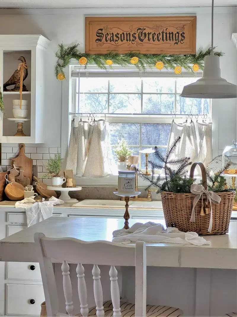 natural greenery in neutral cottage kitchen decorated for Christmas