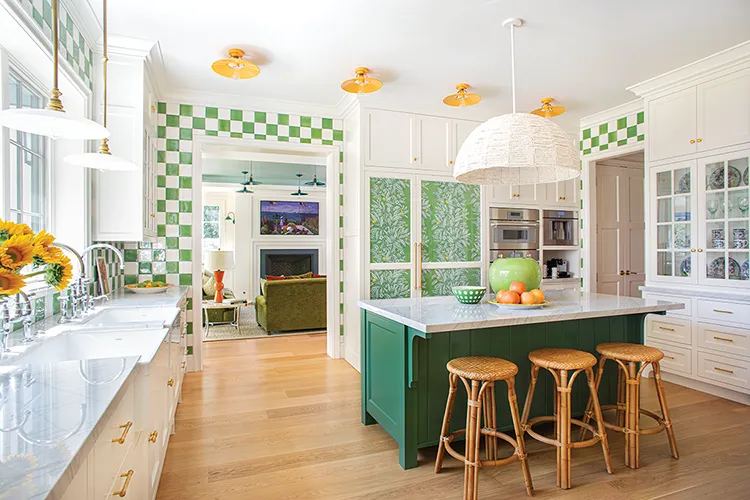 wide angle view of bright and colorful kitchen with green accents