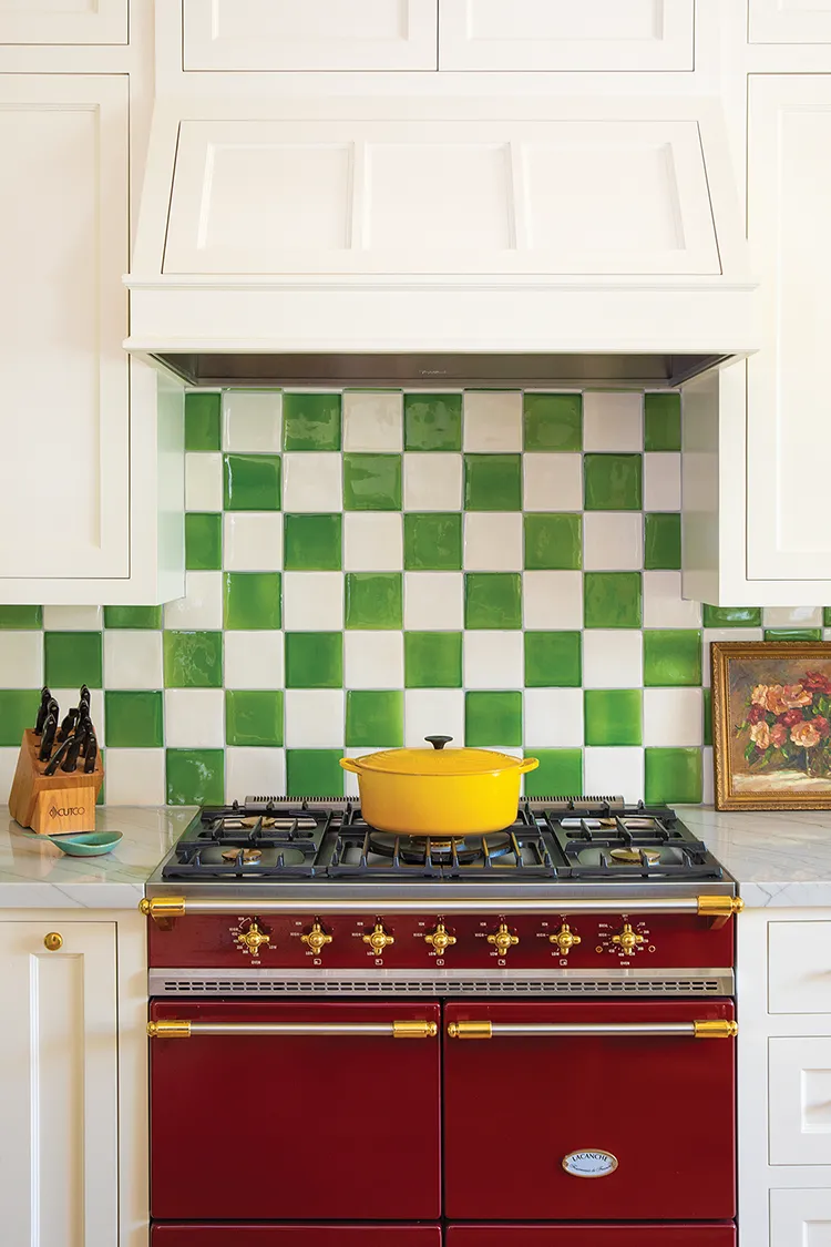 red range and yellow Dutch oven bring more color to the kitchen