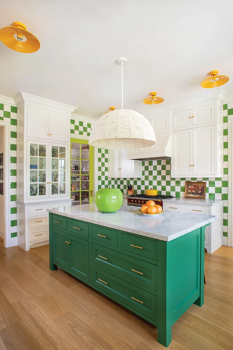 oversized green apple sculpture adds color and whimsy to the kitchen