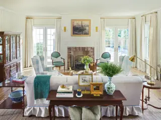 living room with green and blue accent chairs in Project House Utah