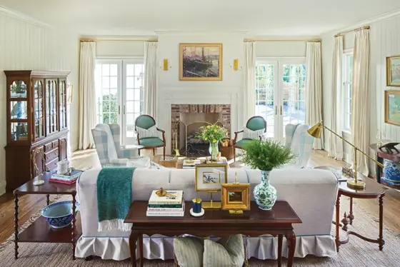 living room with green and blue accent chairs in Project House Utah