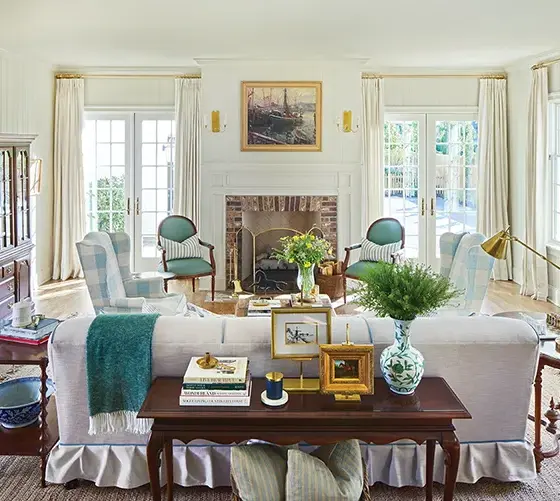 living room with green and blue accent chairs in Project House Utah