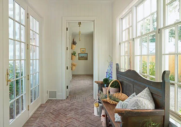 hanging baskets with decorative wheat in hallway with French doors in completed Project House Utah