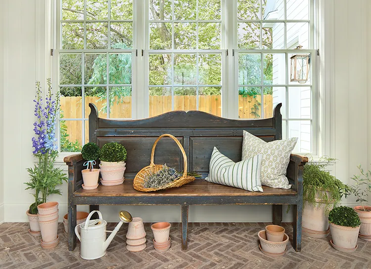 gardening area with antique bench and terracotta pots in completed Project House Utah