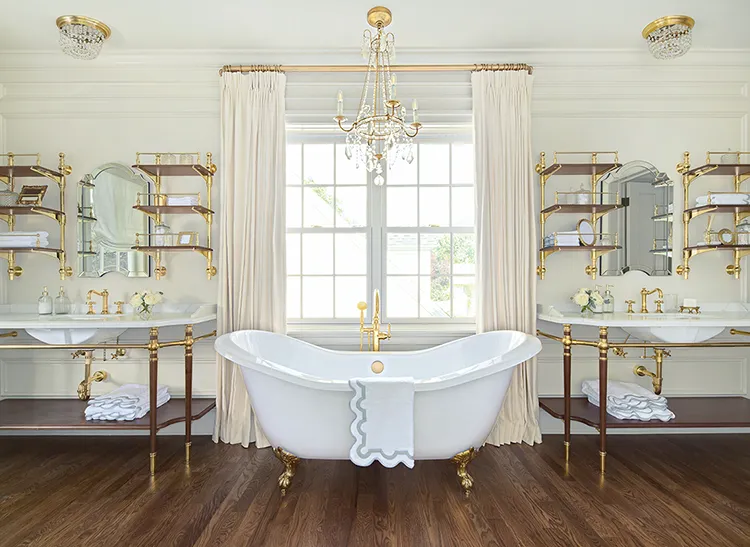 spacious bathroom with chandelier and clawfoot tub in final reveal of Project House Utah