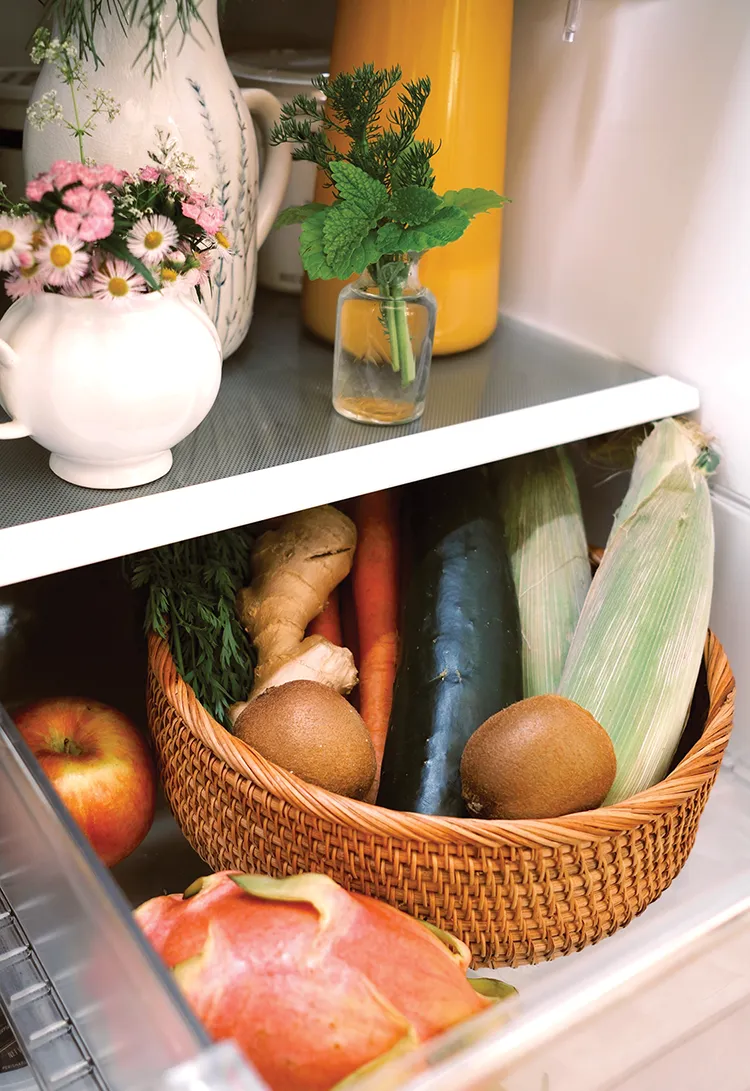 woven basket containing fresh fruits and vegetables