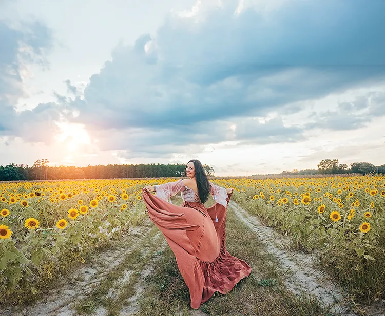 Krystle Nickels in field of sunflowers