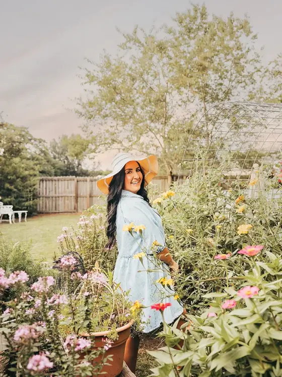 Krystle Nickels, 2025 Brand Ambassador for Cottages and Bungalows, in her garden