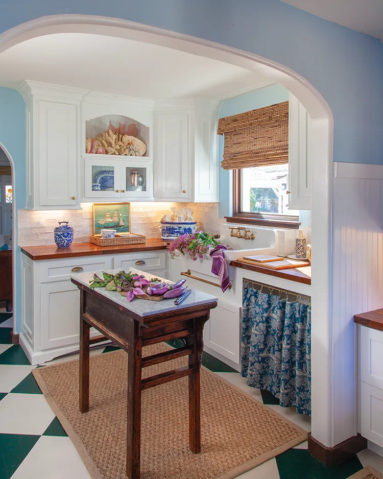 blue and white coastal cottage kitchen in renovated Spanish bungalow