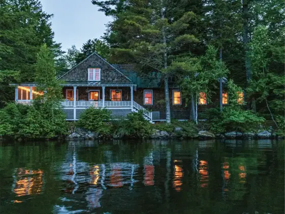 waterfront cottage in Maine at twilight