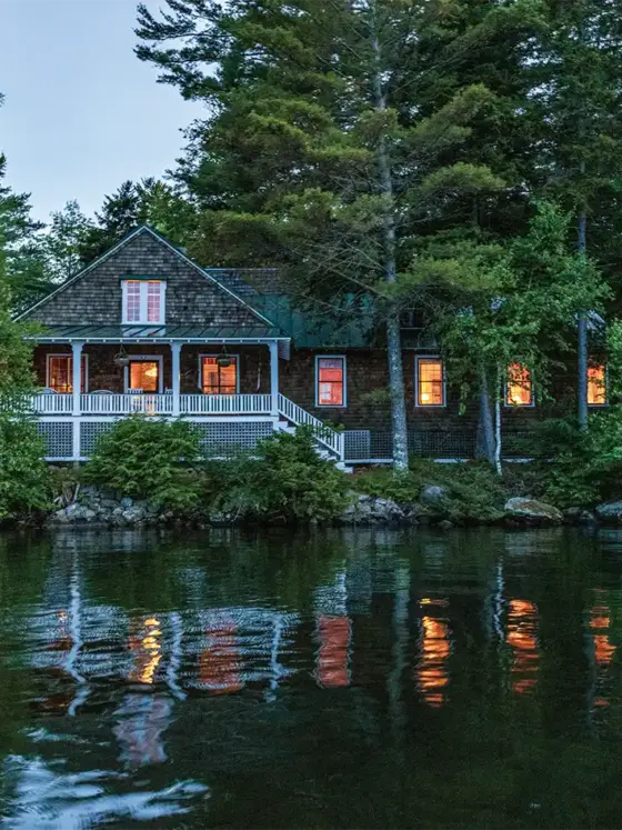 waterfront cottage in Maine at twilight