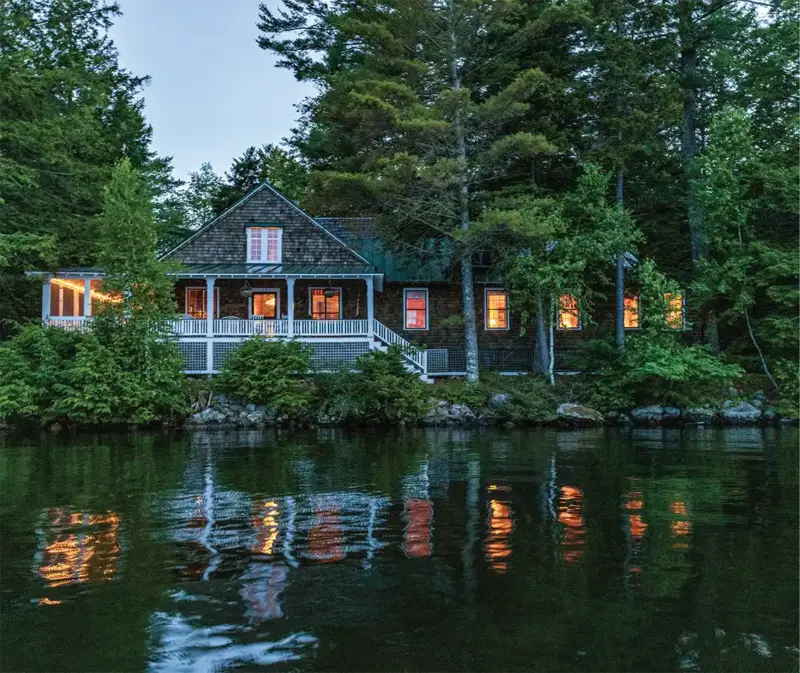 waterfront cottage in Maine at twilight