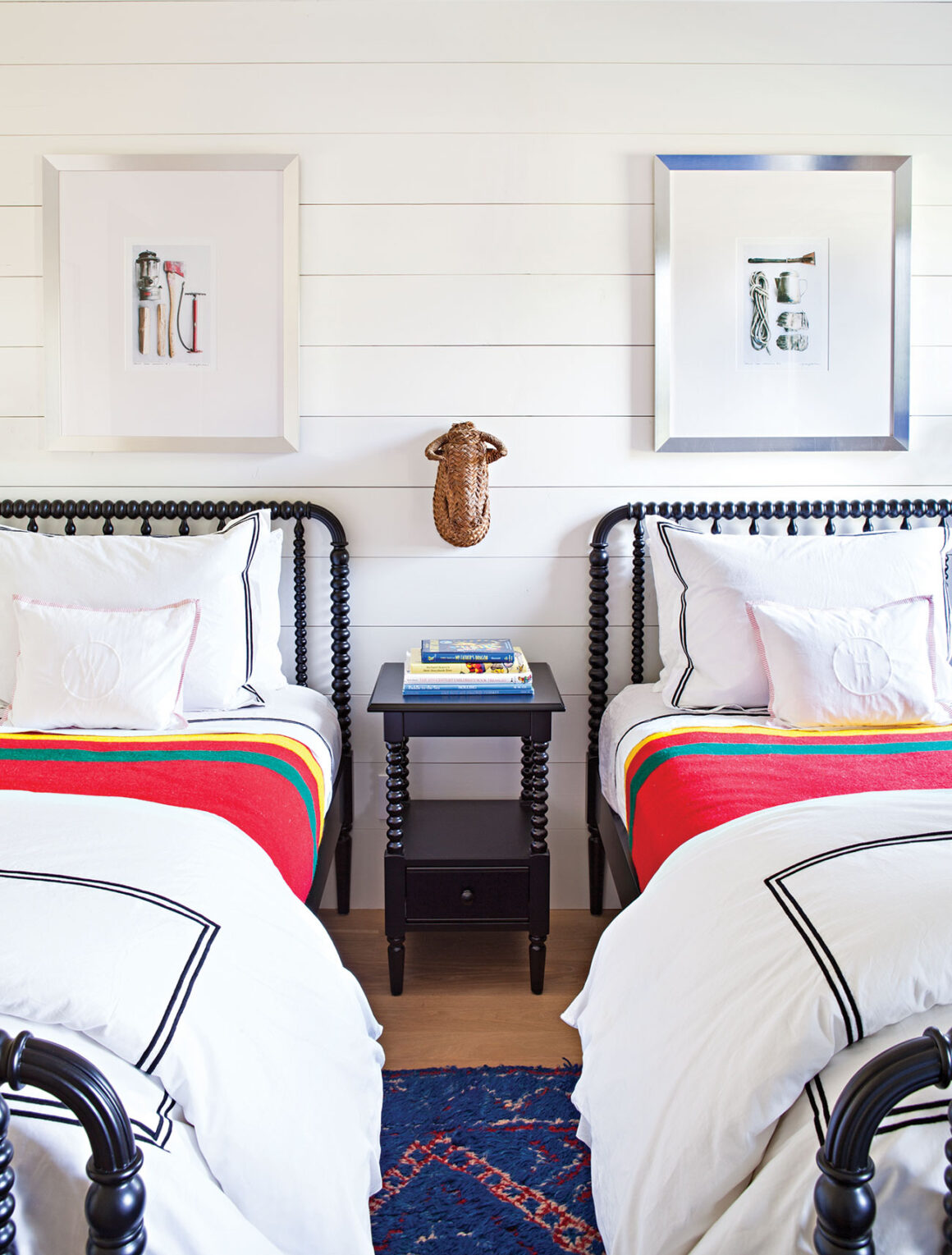 kids room with white sheets and colorful blankets