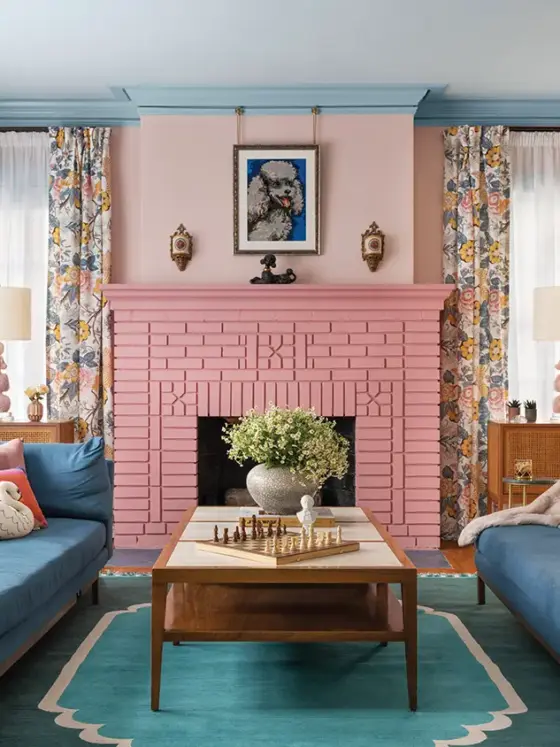 living room with floral curtains and pink brick fireplace