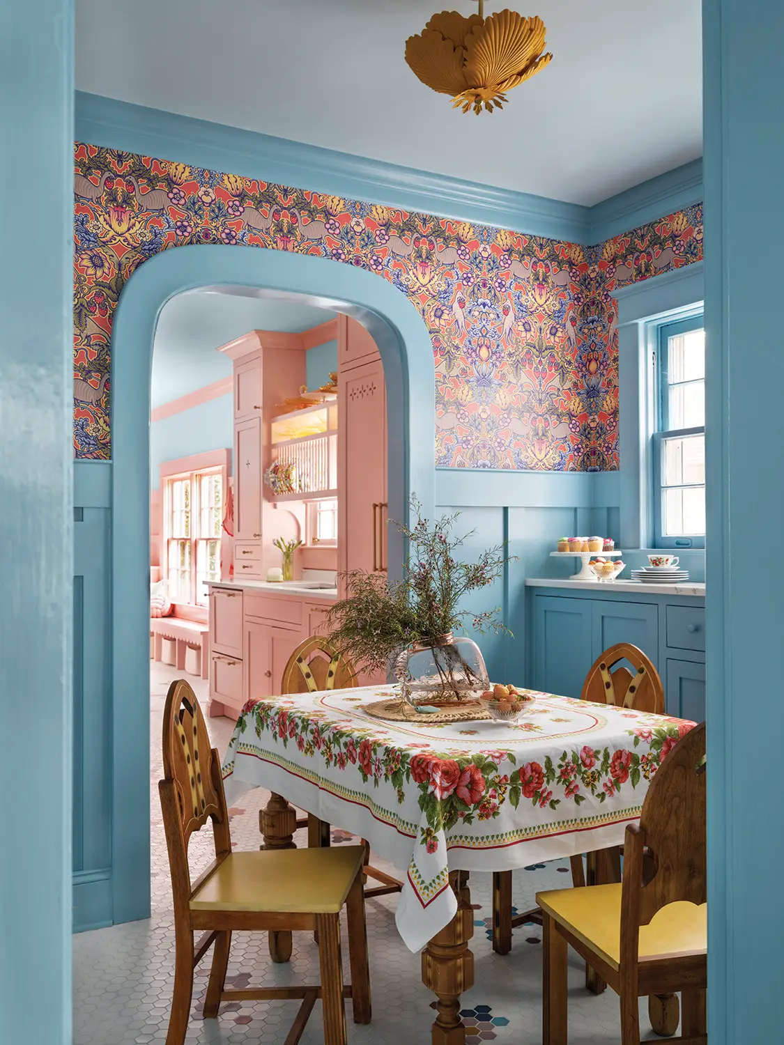 dining room with floral wallpaper and blue trim in 1930 Tudor home